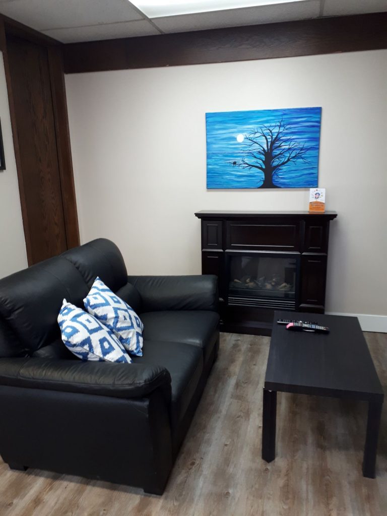 Hinton Homeless Resource Room lounge area with a couch to relax